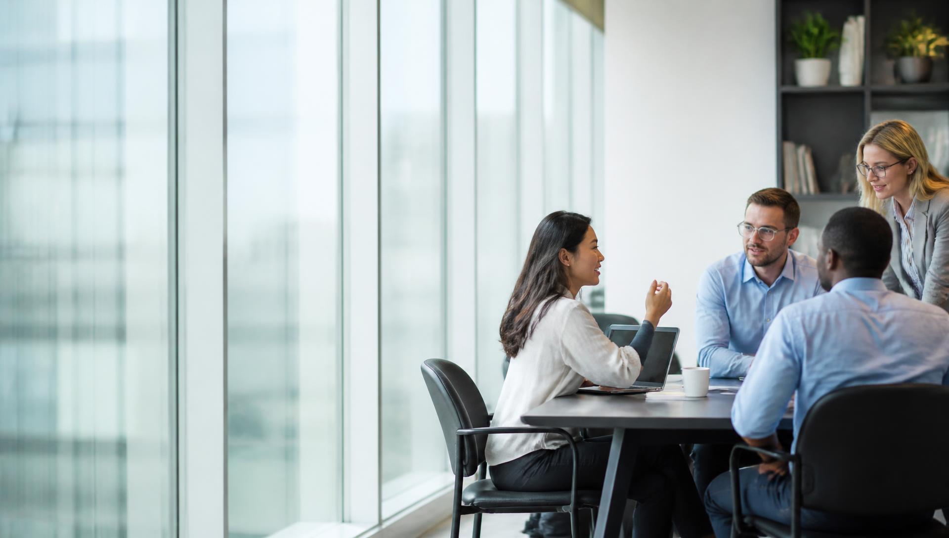 Professionals collaborating in a bright modern U.S. workplace